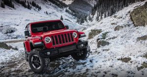 Jeep Wrangler driving in the snow