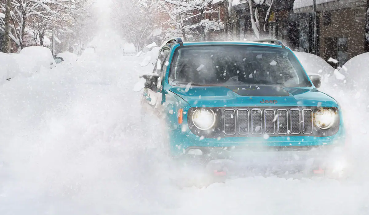 The 2021 Jeep Renegade driving in snow