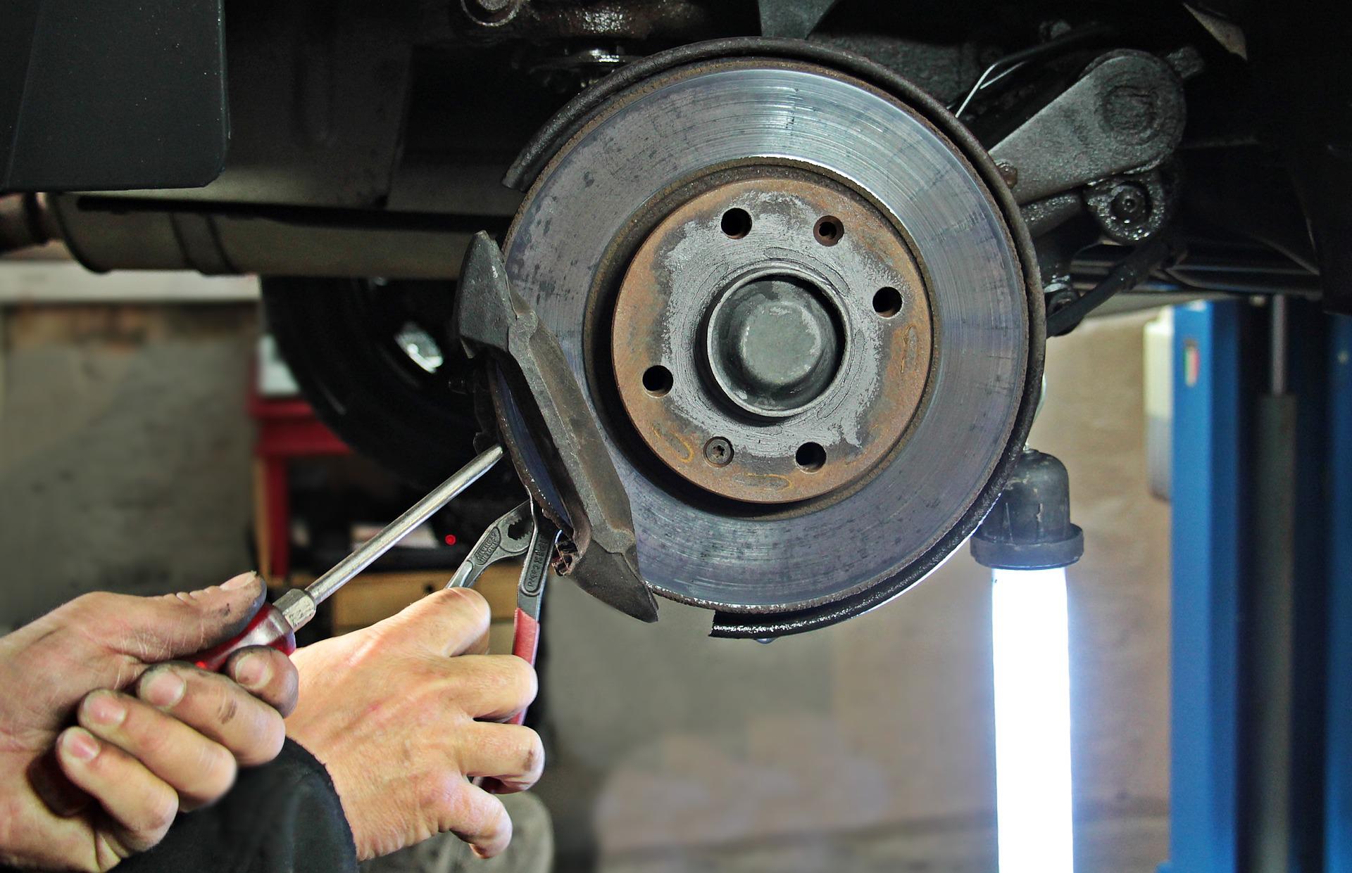 A brake pad being worked on
